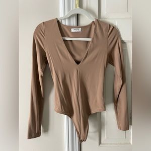 Small nude Aritzia bodysuit.